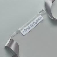 close up detail of the back of a beddybyes silver grey Silk Universal Travel Slip