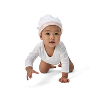 Baby wearing BeddyByes Blush Pink Silk Cotton Baby Hat