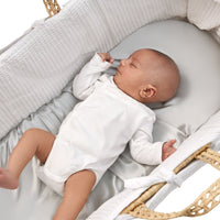 adorable newborn laying on a beddybyes silver grey Silk Moses Basket & Carrycot Fitted Sheet