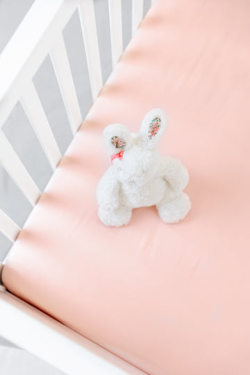 BeddyByes Blush Pink Silk Cotbed Fitted Sheet with bunny rabbit soft toy